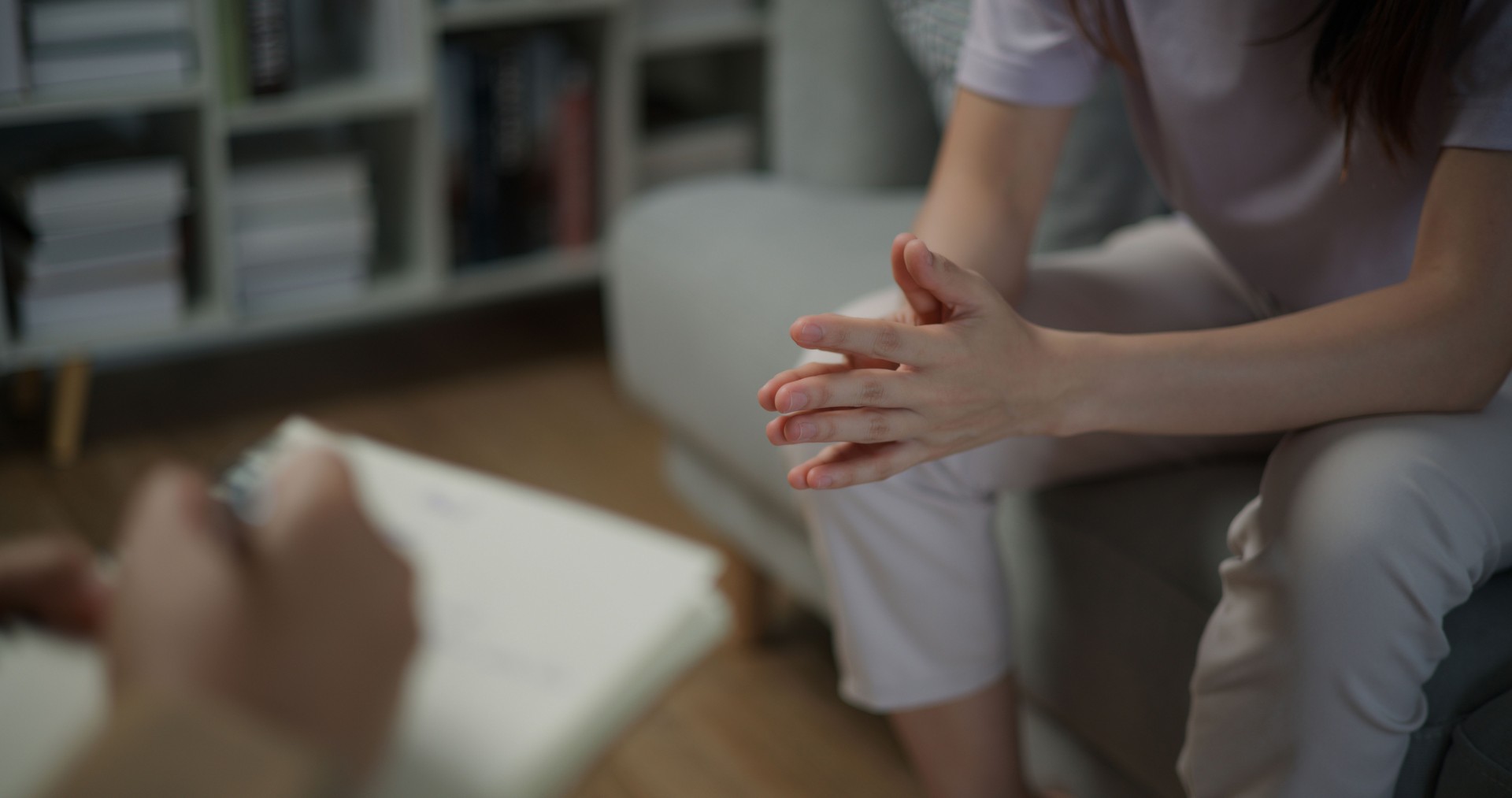 Hands of young patient while talking to therapist with stress, confusion or fear